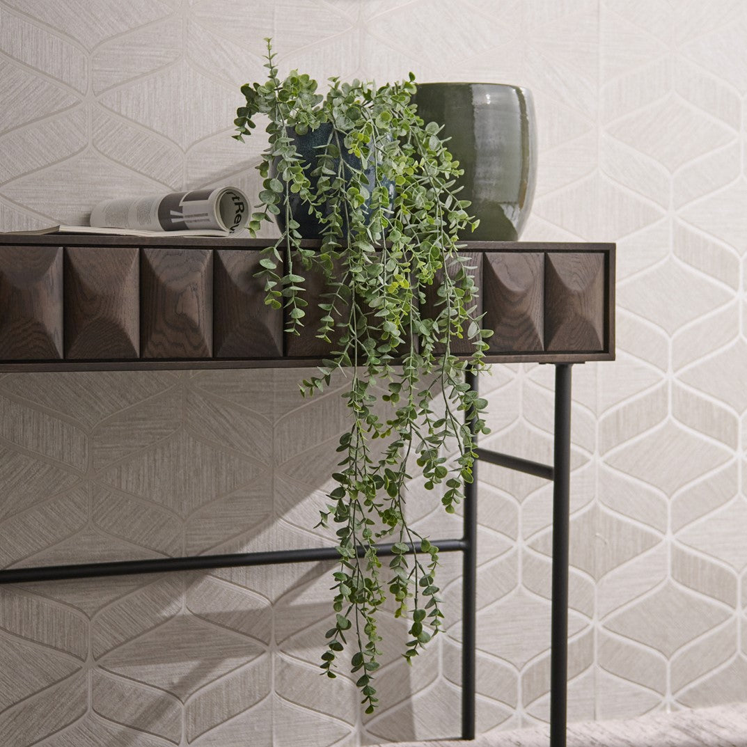 Dark wood decorative console table with a  fake green plant.