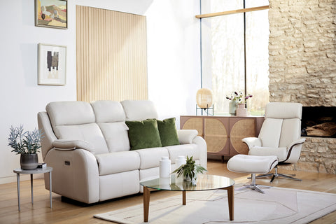 Modern living room with a  G Plan white sofa, armchair, and coffee table.