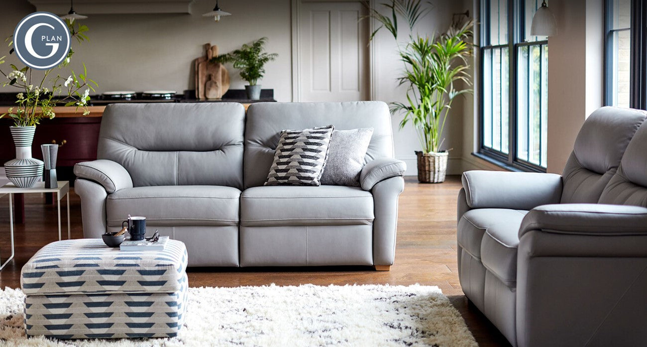 Grey G Plan sofa set in a living room with decor elements.