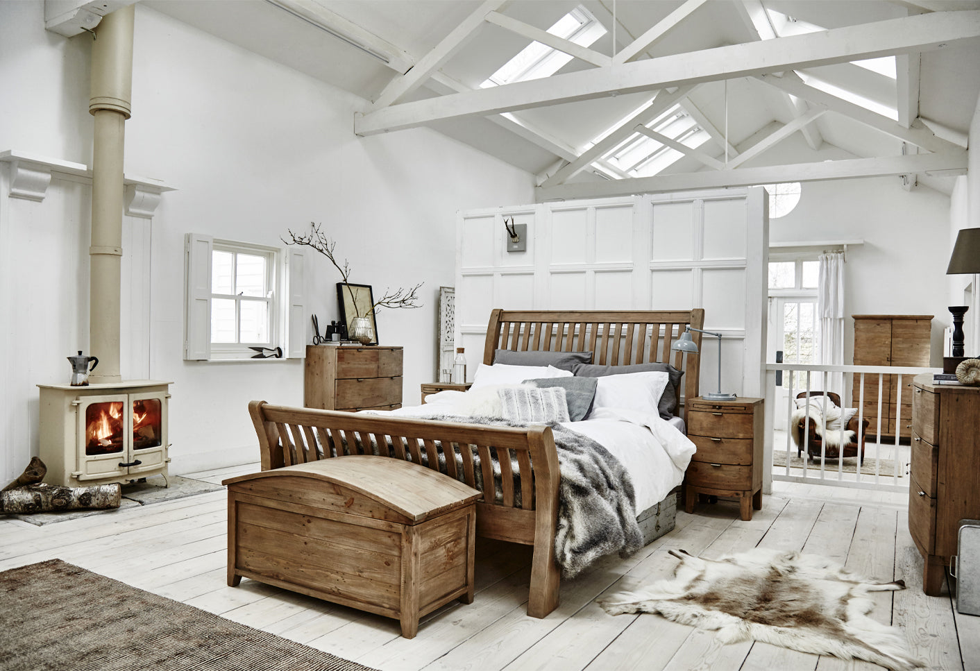 Cozy bedroom with wooden furniture and white walls