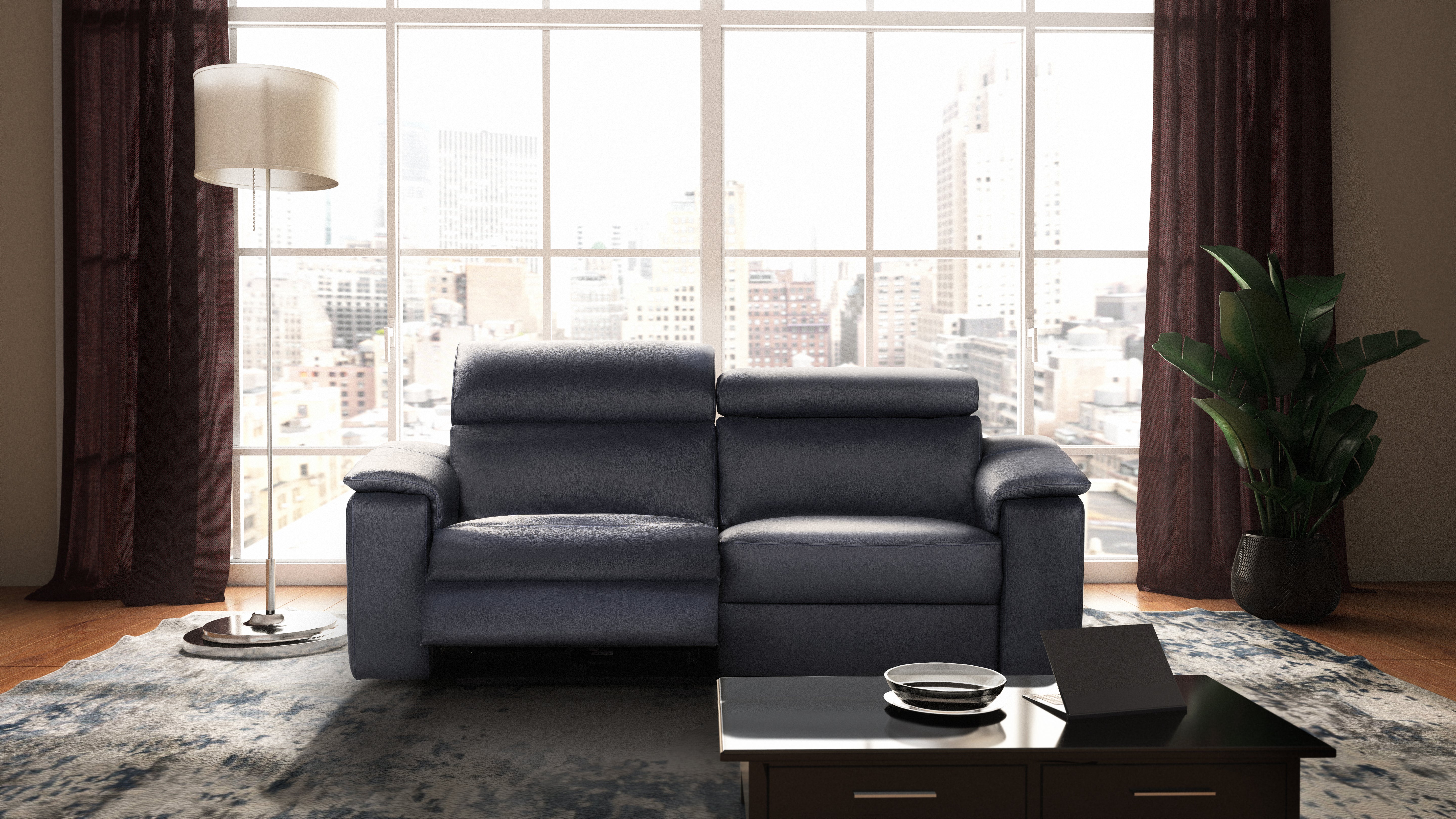 Seattle modern living room with a black leather sofa, coffee table, and cityscape view.