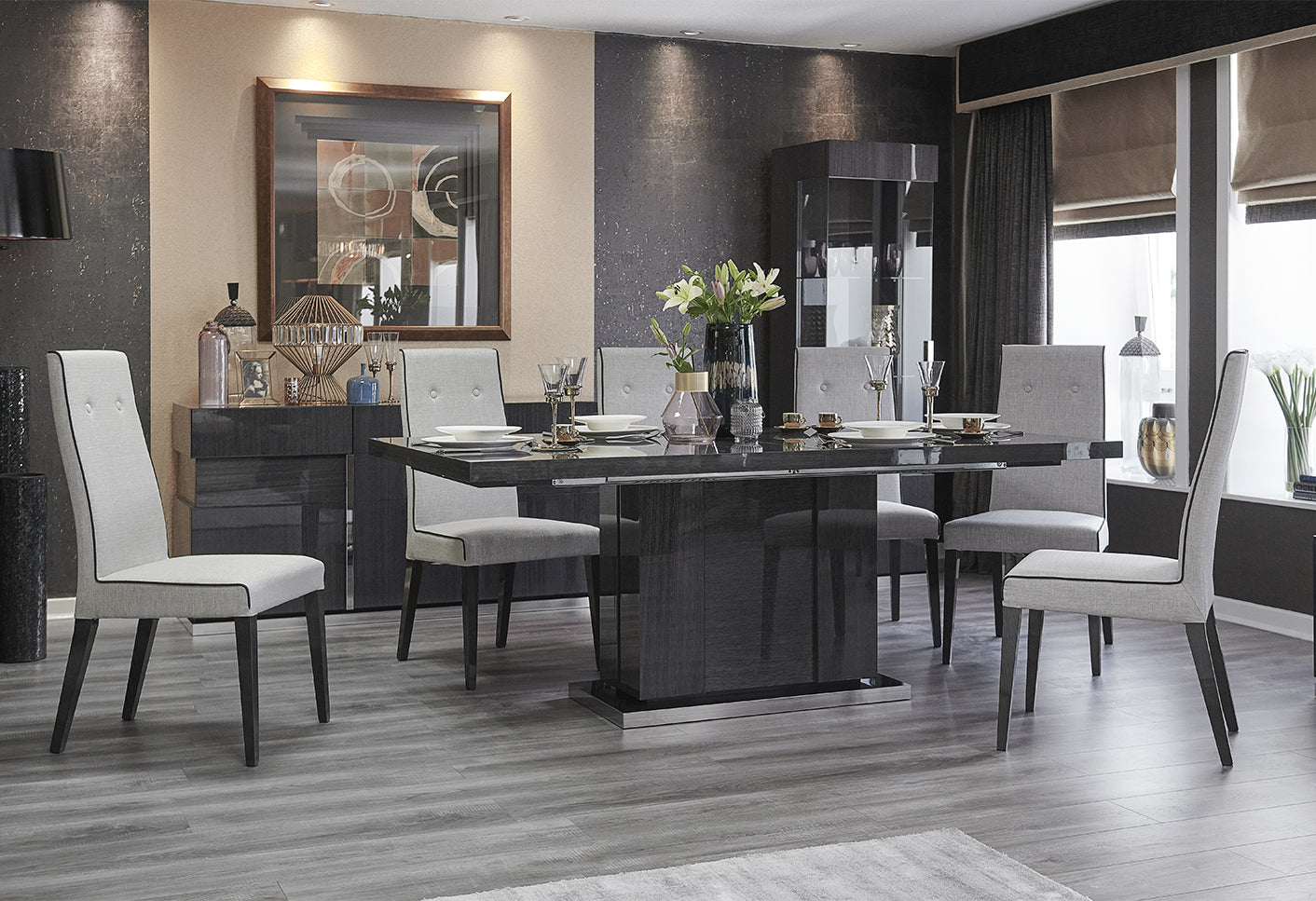 Dining room with a modern table and chairs in a stylishly decorated room.