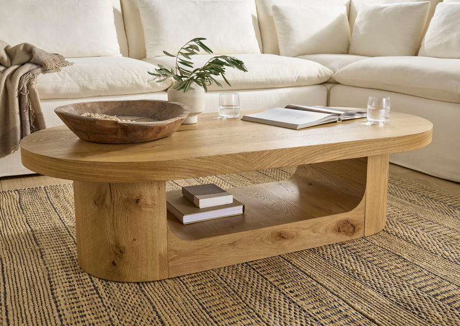 Wooden coffee table with decorative items in a living room setting
