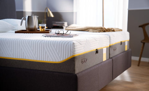 Bed with Tempur mattress in a bedroom setting