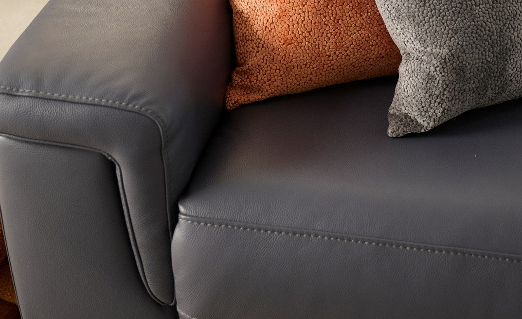 Up close texture shot of a navy leather sofa 