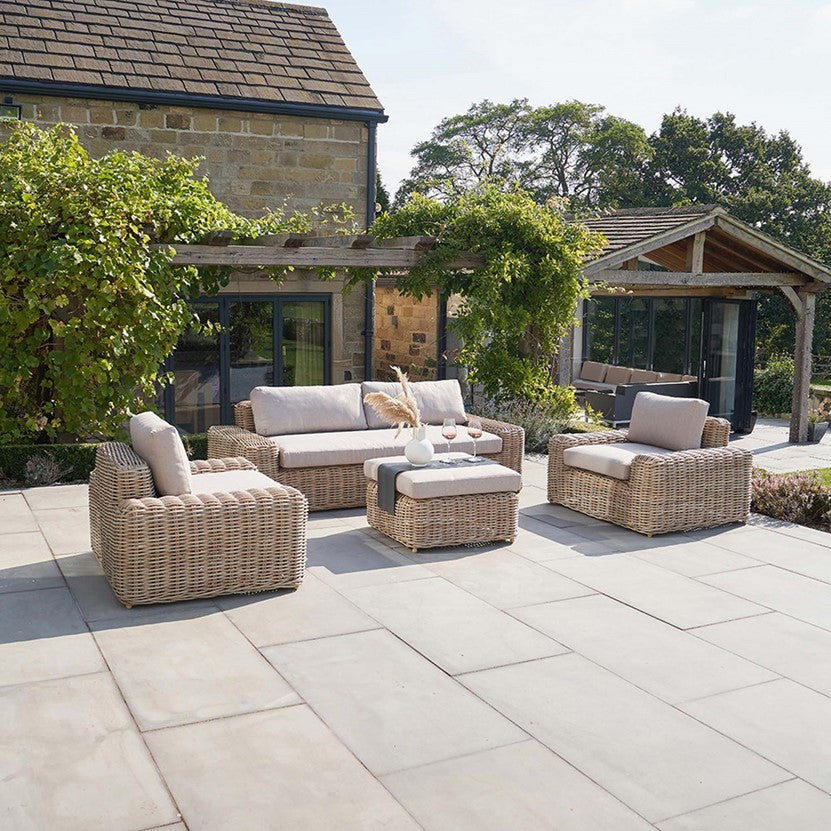 Outdoor patio with Rattan furniture set on a stone patio