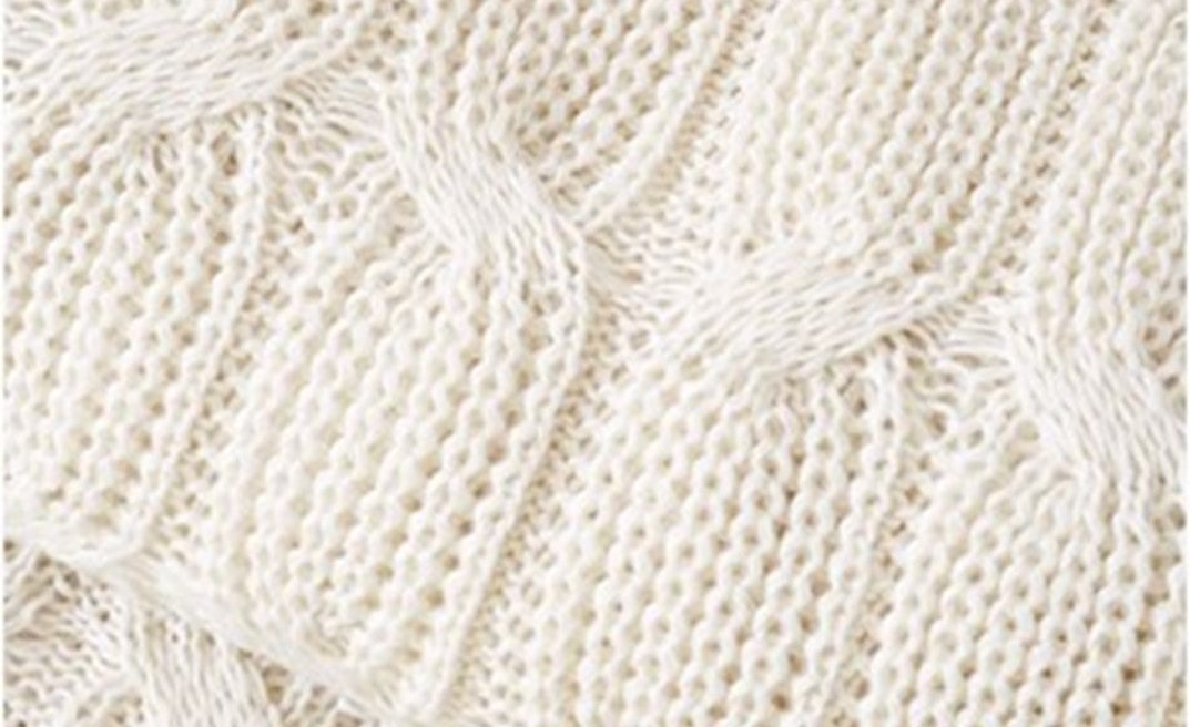 Close-up of a textured beige fabric pattern