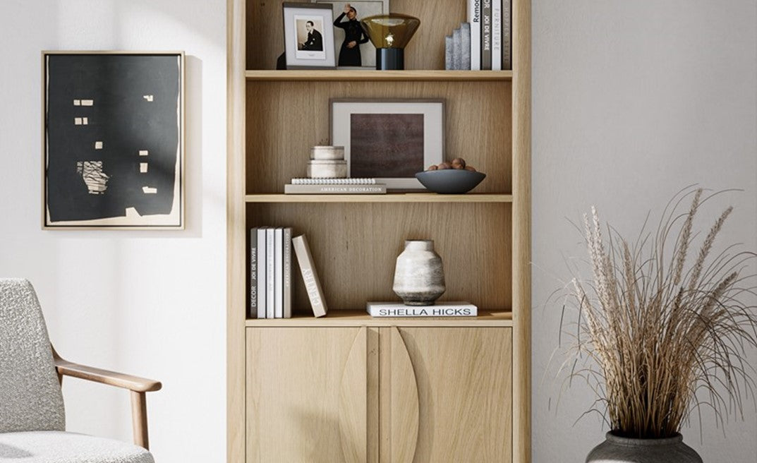 Wooden display cabinet with decorative items in a room setting