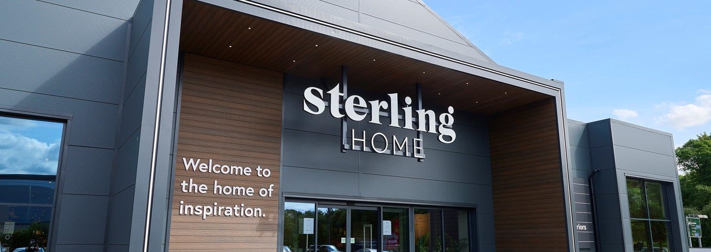 Sterling Home store entrance with sign and welcoming message.