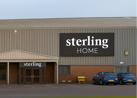 Building exterior with 'sterling HOME' sign and 'sterling' logo above doors.